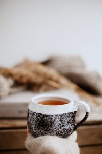 tea cup in hand
